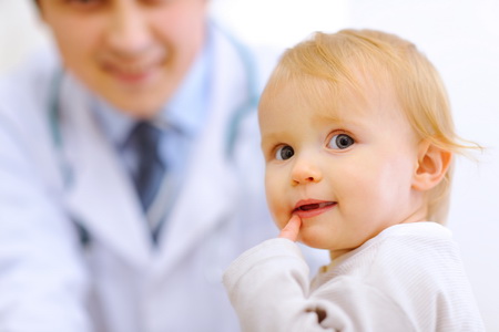 Doctor observing a child