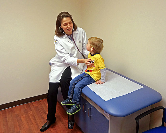 Holmdel, NJ pediatric office - Dr. Yelena Potylitsina checking a child's vitals